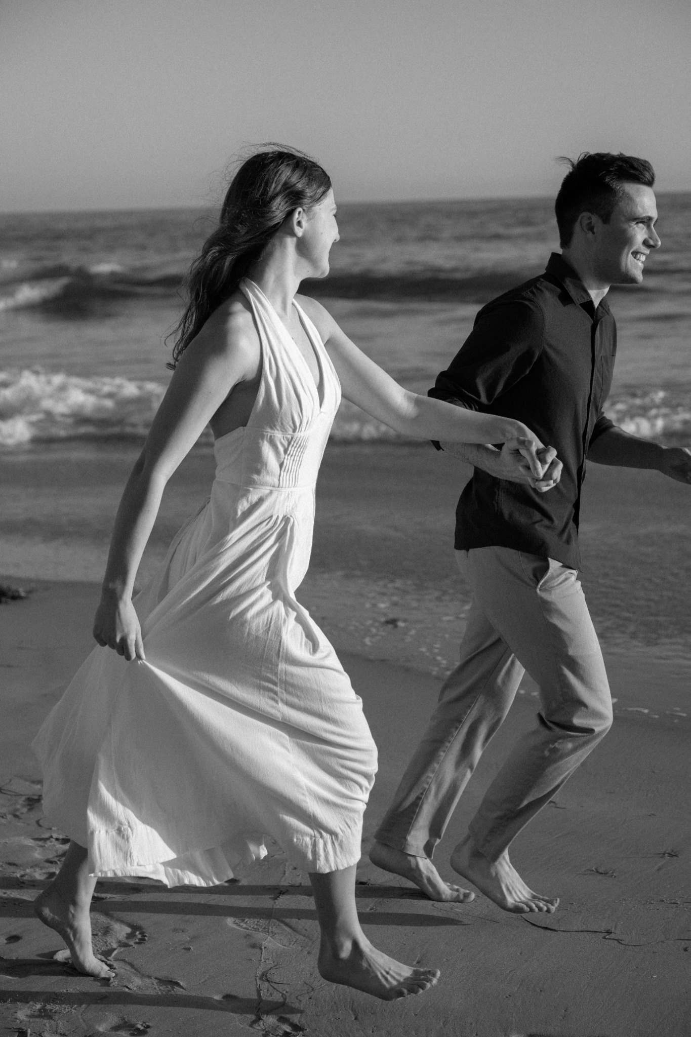 Molly and Nick standing together at the beach